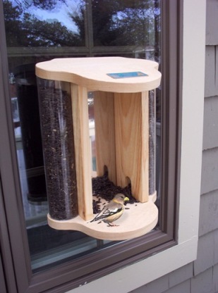 Bird feeder! One way mirror, the birds can't see you but you can